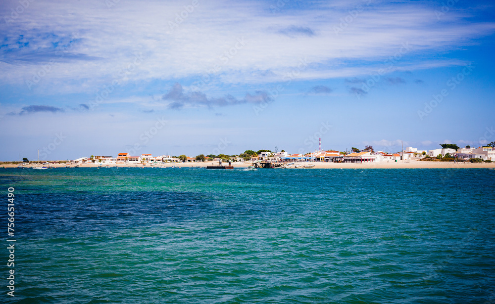 view of armona island beach from the sea in algarve