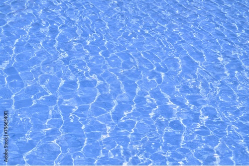 blue water in swimming pool at summer sunshine. 