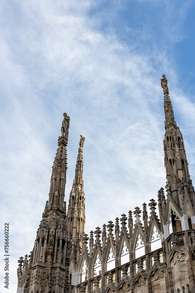 The famous Milan Cathedral (Duomo di Milano) on the Piazza del Duomo in Milan, Italy. Details on the roof
