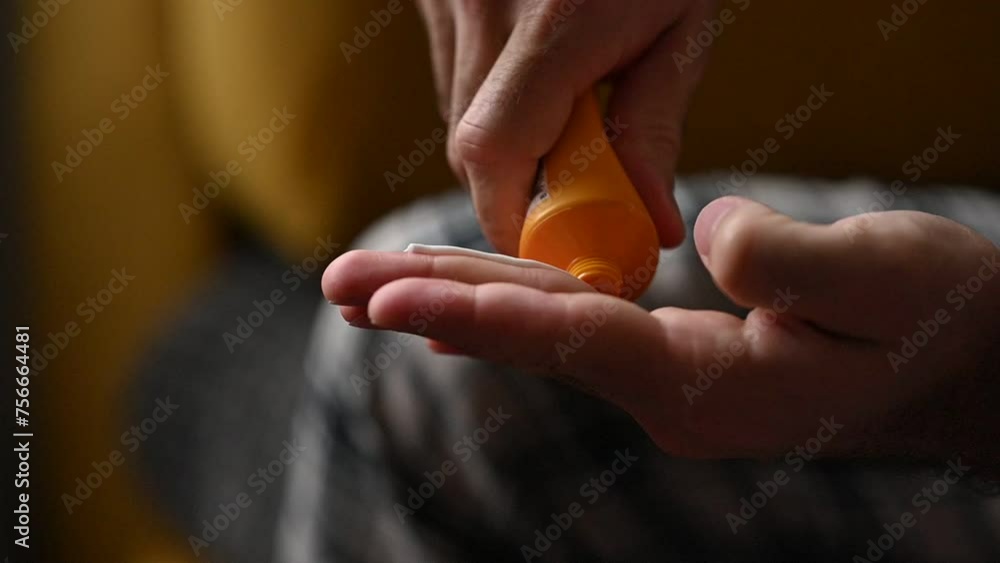Man squeezing cream out of tube on hands. High quality FullHD footage Man squeezing cream out of tube on hands. High quality FullHD footage