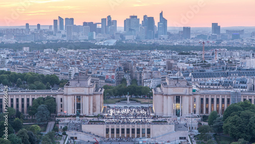 Aerial view over Trocadero day to night timelapse with the Palais de Chaillot seen from the Eiffel Tower in Paris, France.