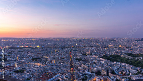 Panorama of Paris after sunset day to night timelapse. Top view from montparnasse building in Paris - France