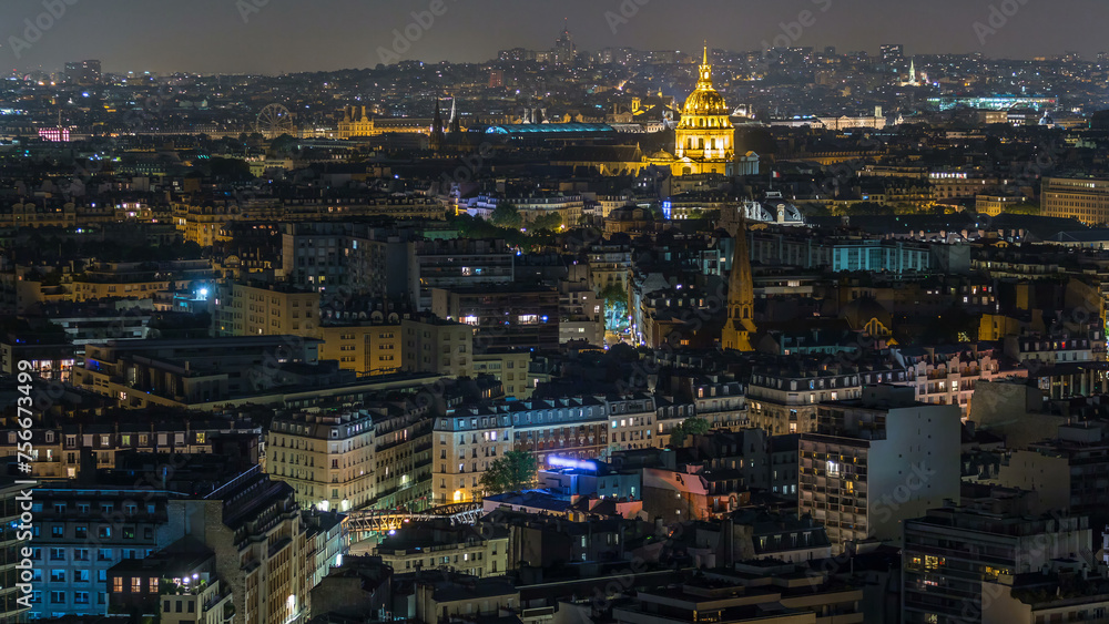 Fototapeta premium Aerial panorama above houses rooftops in a Paris night timelapse