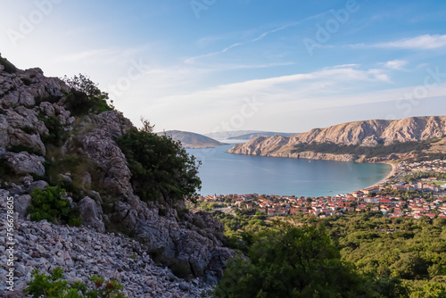 Fototapeta Naklejka Na Ścianę i Meble -  Panoramic aerial view of idyllic coastal town Baska, Krk Island, Primorje-Gorski Kotar, Croatia, Europe. Coastline of Mediterranean Adriatic Sea surrounded by karst mountains. Archipelago Kvarner Bay