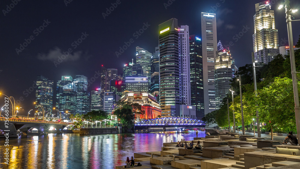 Fototapeta premium Business Financial Downtown City and Skyscrapers Tower Building at Marina Bay night timelapse hyperlapse, Singapore