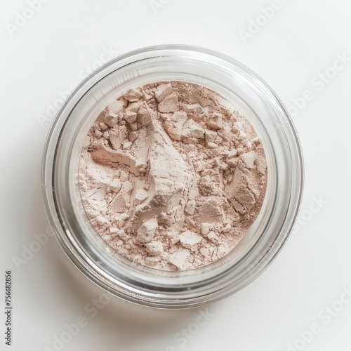 cosmetic powder for makeup in a transparent jar, on a white background.
