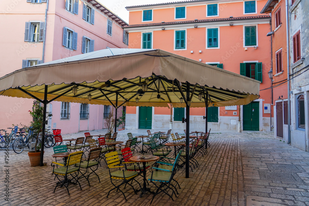 beautiful colorful square in Rovinj old town with restaurants