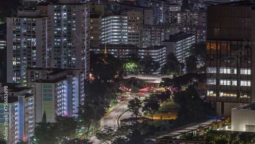 Photography Aerial skyline with apartment buildings and skyscrapers of Singapore night timel