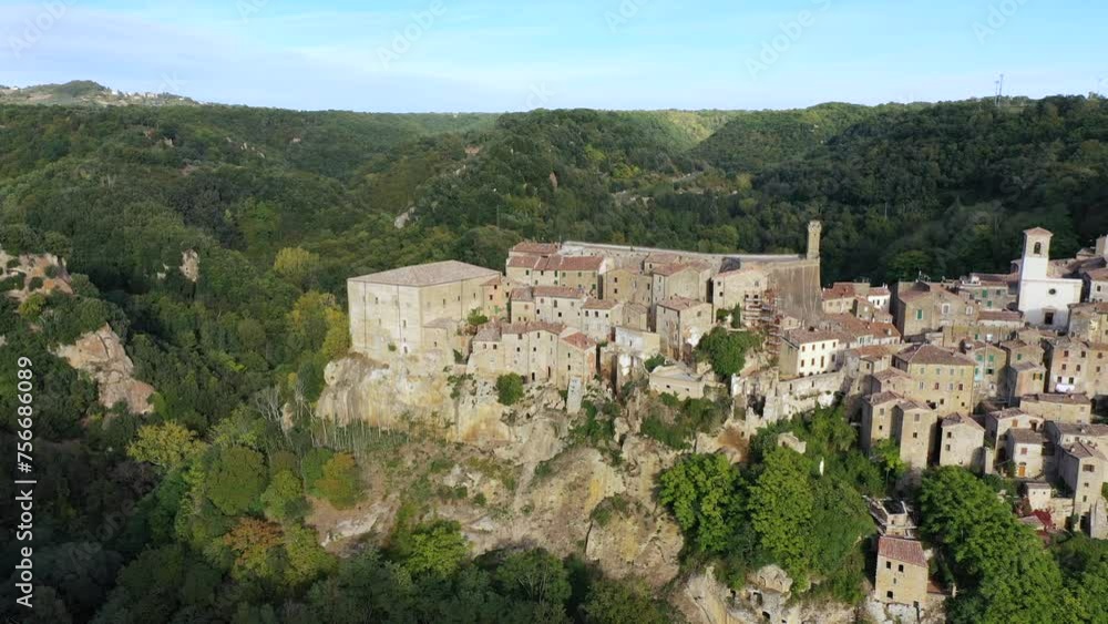Sorano, a town built on a tuff rock, is one of the most beautiful city in Italy. Sorano as an ancient medieval hill town hanging from a tuff stone over the Lente River, Tuscany, Italy. Sorano, a town built on a tuff rock, is one of the most beautiful city in Italy. Sorano as an ancient medieval hill town hanging from a tuff stone over the Lente River, Tuscany, Italy.
