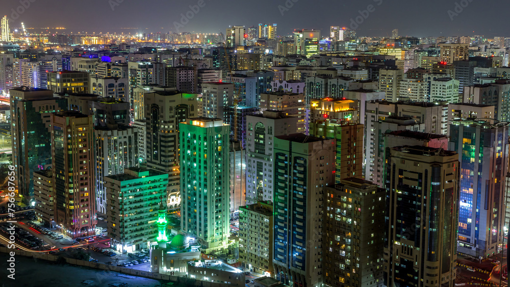 Obraz premium Aerial skyline of Abu Dhabi city centre from above night timelapse