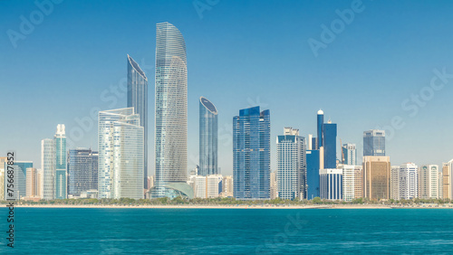 View of high skyscrapers on a corniche in Abu Dhabi stretching alongside the business center timelapse. © neiezhmakov