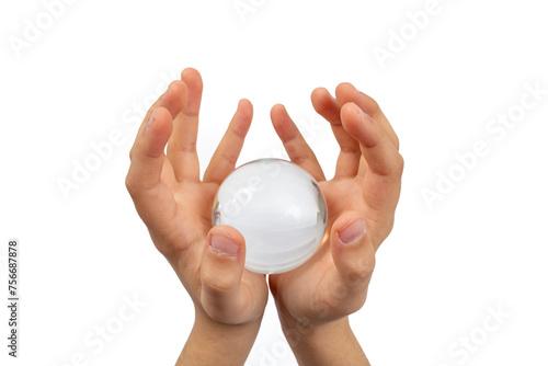 Child hands holding a glass sphere isolated on white background, minimal empty backdrop
