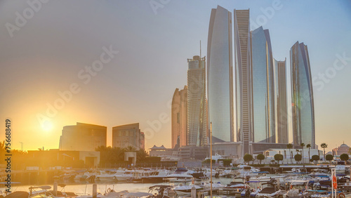 Al Bateen marina Abu Dhabi timelapse with modern skyscrapers on background photo