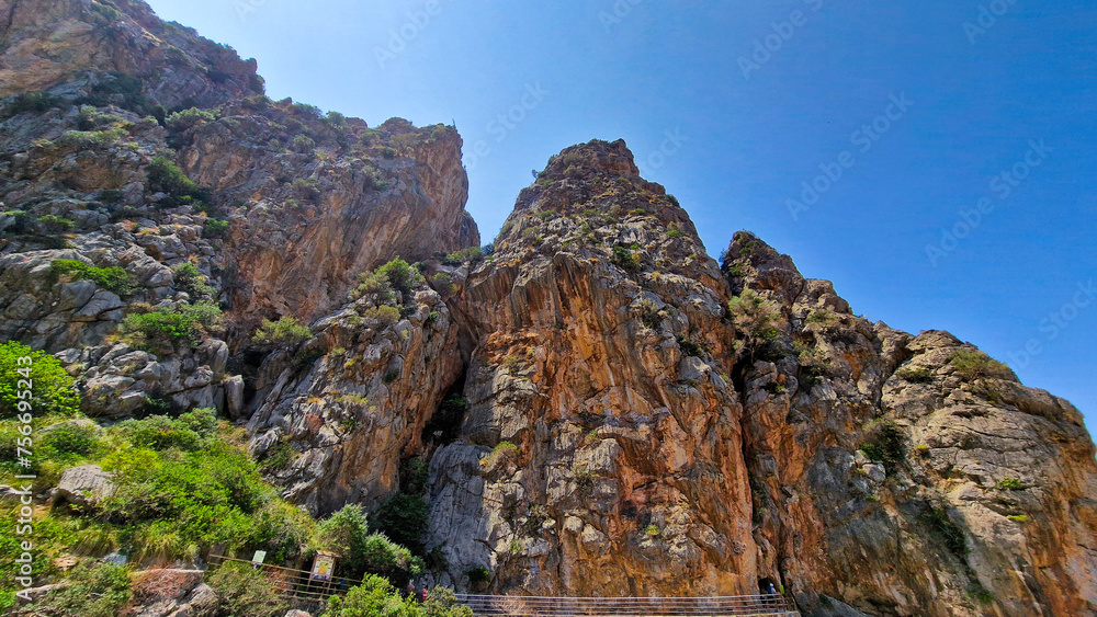 Cliffs of Sa Calobra in Mallorca touching the clear sky