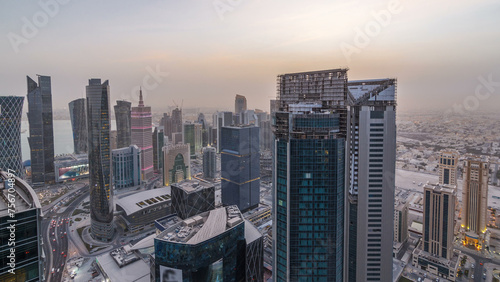 The skyline of the West Bay area from top in Doha day to night timelapse, Qatar. photo