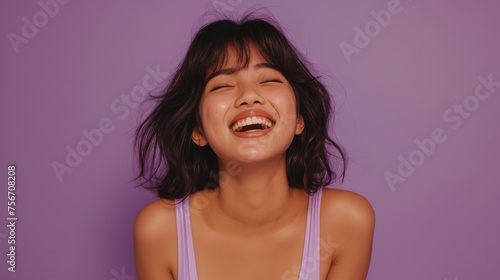 Joyful Asian American Teen Girl in Lavender Swimwear, Lavender Background 