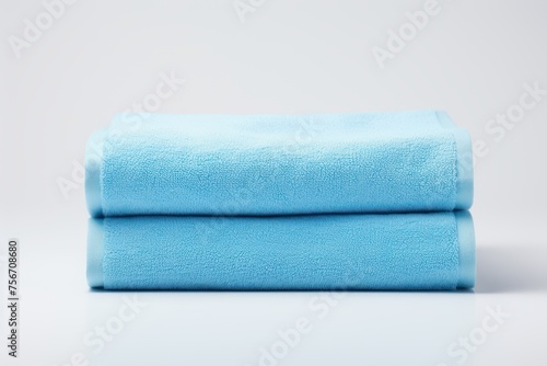 Fluffy blue towel on a light background