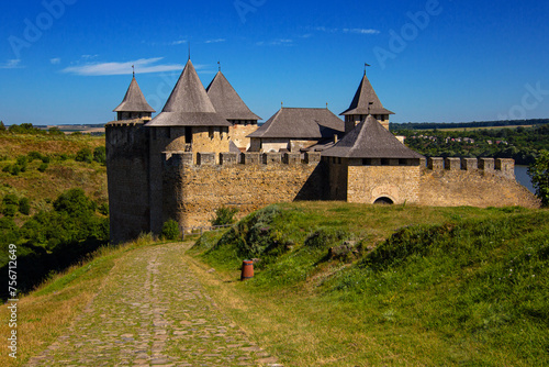 Khotyn castle, ancient fortress during summer sunny day. Medieval fortification on the banks of the Dniester River, one of the famous and largest castles that belongs to the seven wonders of Ukraine. 