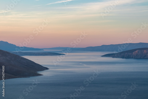 Panoramic sunrise view of deserted island Prvic seen from idyllic hiking trail near coastal town Baska, Krk Otok, Primorje-Gorski Kotar, Croatia, Europe. Majestic coastline Mediterranean Adriatic Sea