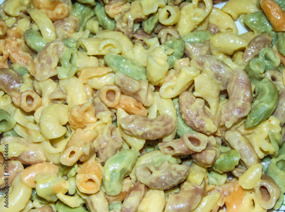 Colored pasta with parmesan and egg yolk Colored pasta with parmesan and egg yolk