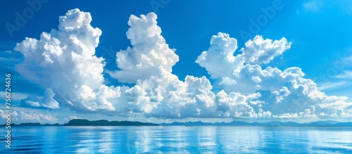 A large body of water reflecting clouds in the sky.