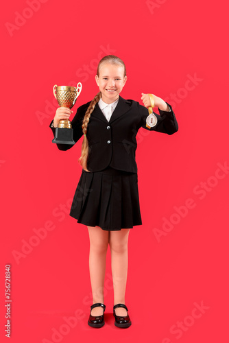 Cute little schoolgirl with...