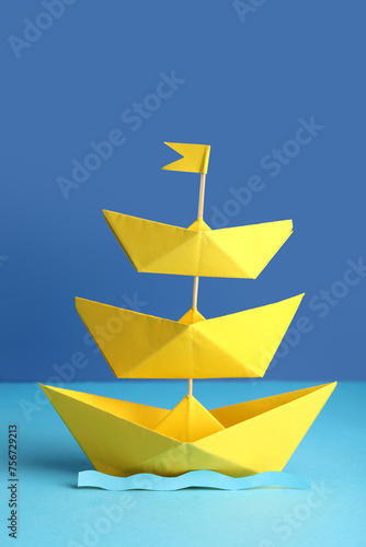 Yellow origami paper boats ...