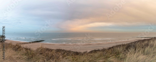 Beach near Domburg town in spring fresh morning with cloudy sky photo