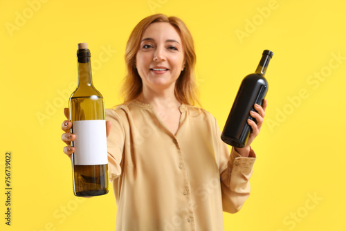 Mature woman with bottles o...
