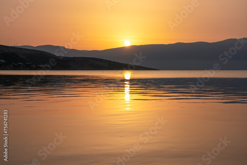 Fototapeta Naklejka Na Ścianę i Meble -  Romantic sunset seen from idyllic coastal town Baska, Krk Island, Primorje-Gorski Kotar, Croatia, Europe. Panoramic view of majestic coastline of Kvarner Bay, Mediterranean Adriatic Sea in summer