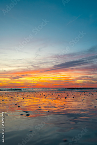 Sunset. Bright colorful sky after sunset. Beautiful seascape. Beach Gulf of Mexico at the dusk. Spring or summer vacation in Florida. Ocean shore Background. Good for tourist agency or post card
