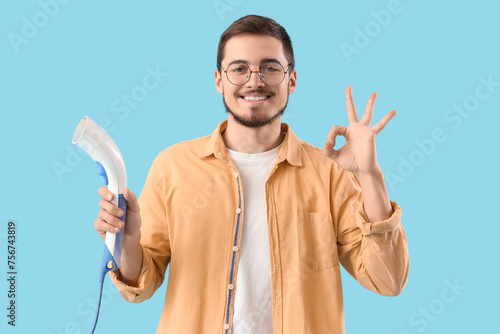 Happy young man with modern...