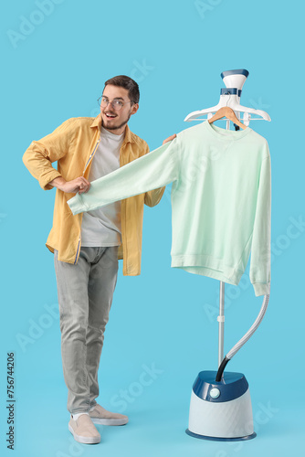 Happy young man with modern...