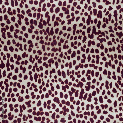Elegant snow leopard spots scatter seamlessly across a clean white textile, ideal for sophisticated fashion and upscale decor.