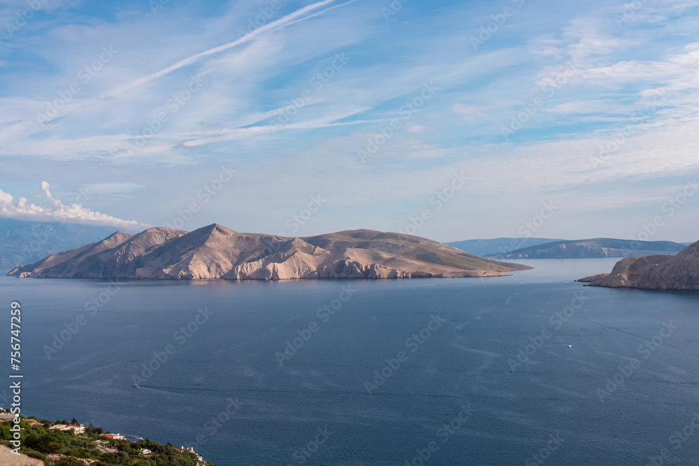 Aerial view of deserted island Otok Prvic in idyllic coastal town Baska, Krk Island, Primorje-Gorski Kotar, Croatia, Europe. Majestic coastline of Kvarner bay in Mediterranean Adriatic Sea in summer