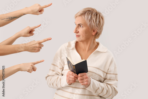 People pointing at mature w...