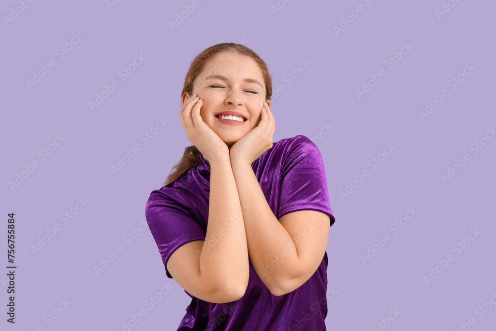 Smiling young redhead woman on lilac background Smiling young redhead woman on lilac background