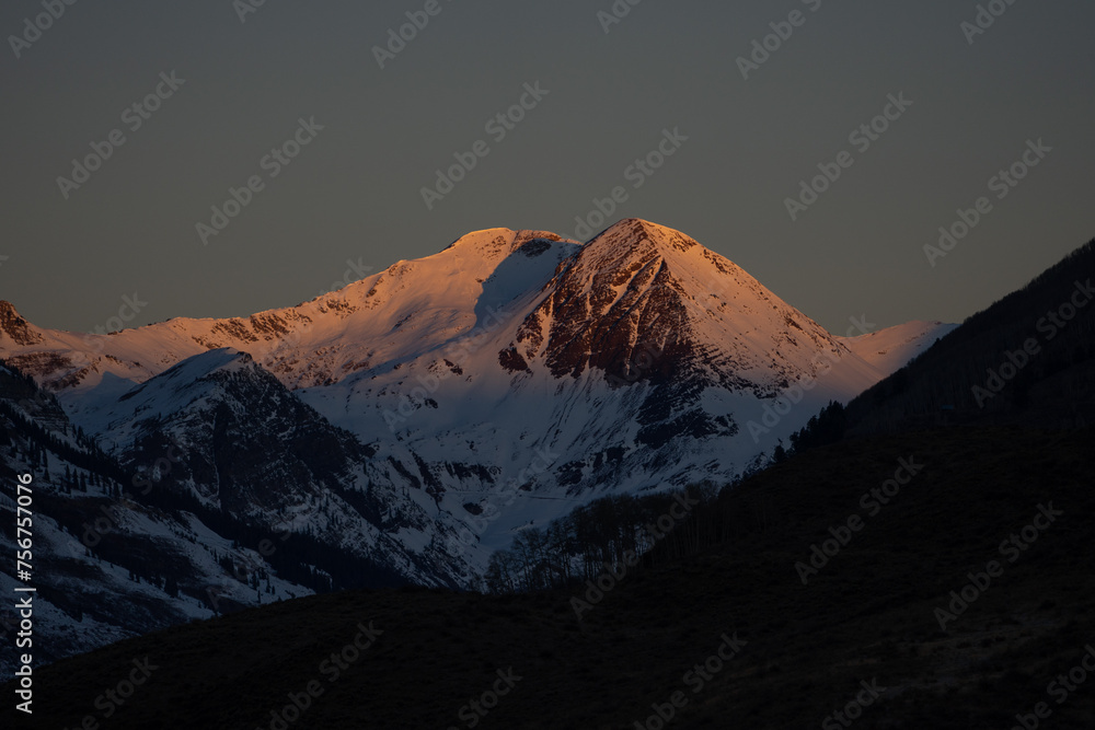 Alpenglow shining on the Paradise Divide mountains near Crested Butte, Colorado Alpenglow shining on the Paradise Divide mountains near Crested Butte, Colorado
