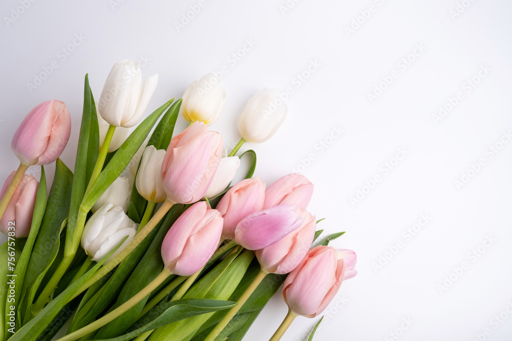 Beautiful bouquet of tulips on a light background. Place for text. Flower card
