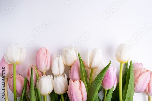 Beautiful bouquet of tulips on a light background. Place for text. Flower card