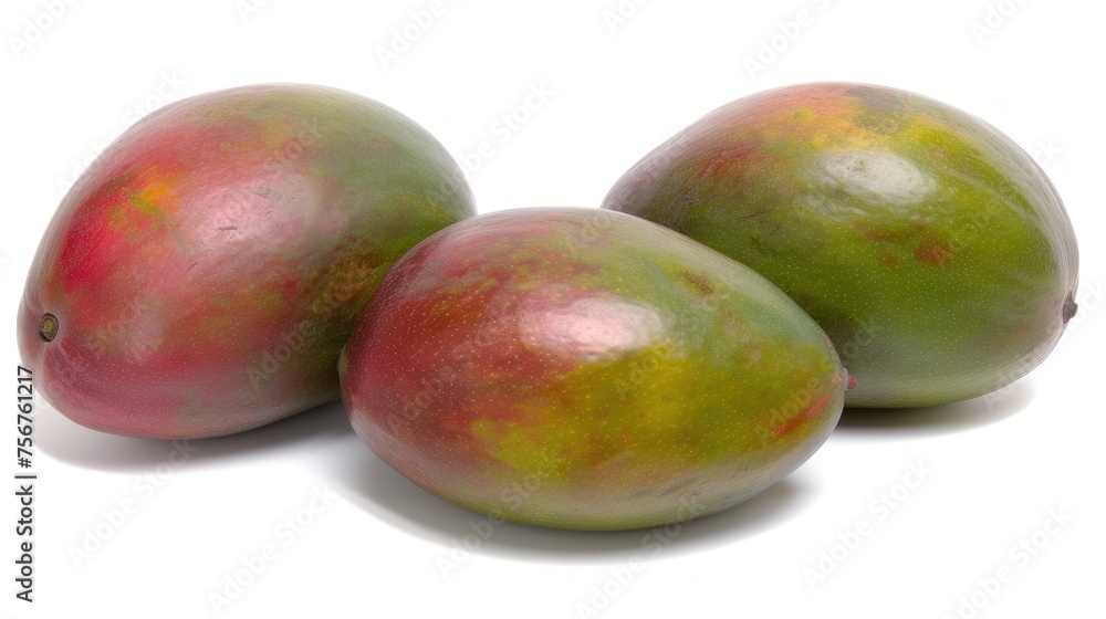 three mangoes sitting on top of each other on a white surface with a red spot on the top of the fruit. three mangoes sitting on top of each other on a white surface with a red spot on the top of the fruit.