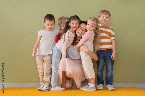 Little children hugging nur...