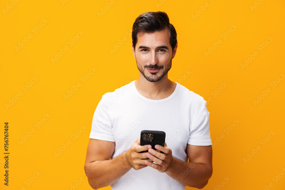 Man phone yellow copy cyberspace phone smartphone happy mobile portrait communication space smiling