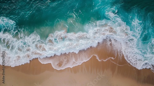 Overhead photo of crashing waves on the shoreline beach. Tropical beach surf. Abstract aerial ocean view © Olesia Khazova