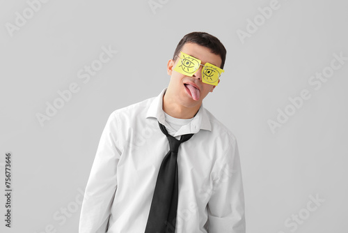Tired young businessman wit...