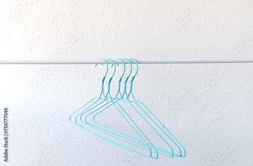turquoise hangers on a rail on a white background, clothes, wardrobe organization