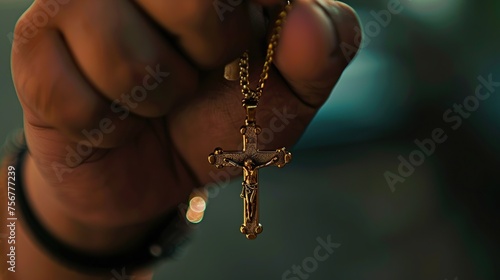 hand holding a Jesus Christ cross necklace