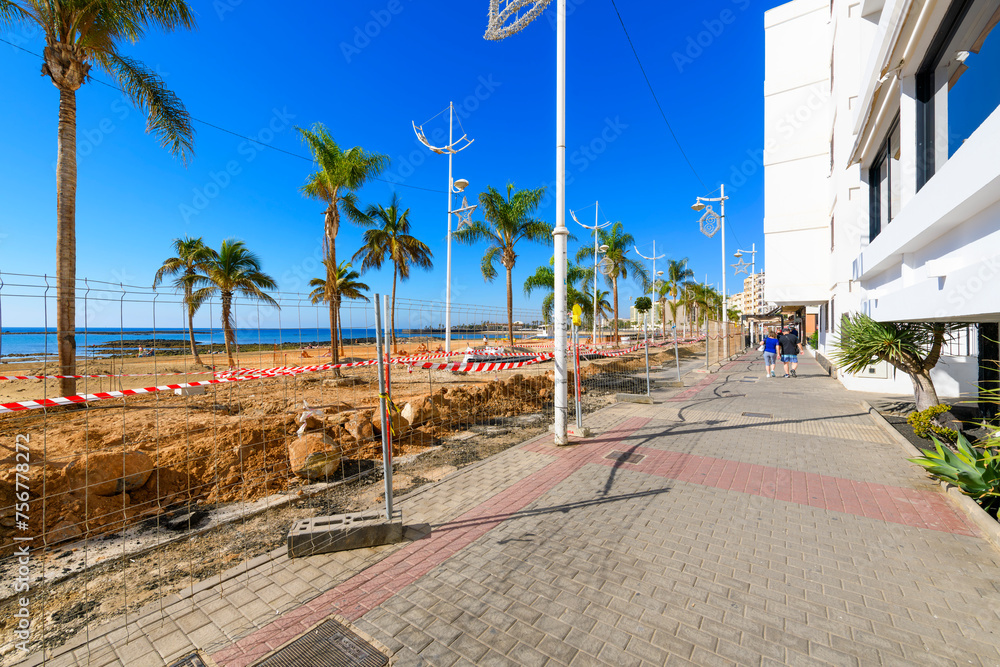 Construction work along the popular waterfront promenade at Playa Reducto, the wide sandy beach at Arrecife, Spain, on the Canary Island of Lanzarote.