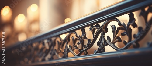 The intricate pattern of the wrought iron railing on the staircase adds a touch of art to the staircase. The metal bumper contrasts beautifully with the wood steps photo