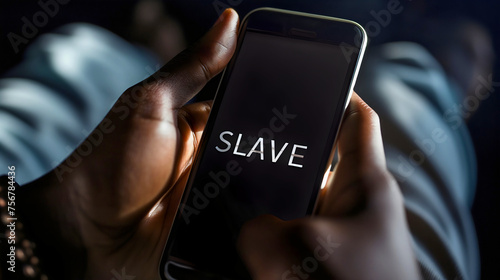Text "Slave" on the smartphone device screen or display. Man holding the cellphone in his hands, photo is symbolizing social media and internet scrolling addiction problem